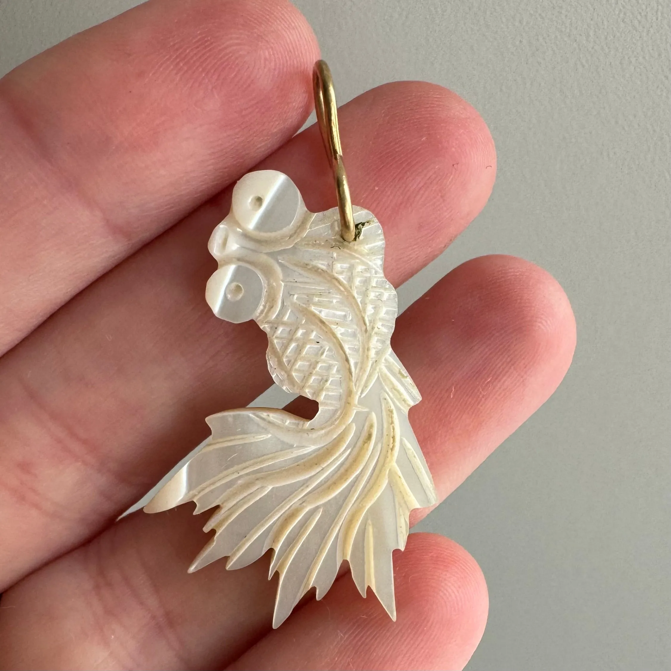 V I N T A G E // lucky fish / carved mother of pearl fish with 14k yellow gold bail / a pendant